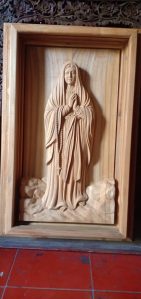 Carved wooden statue of the mother Mary